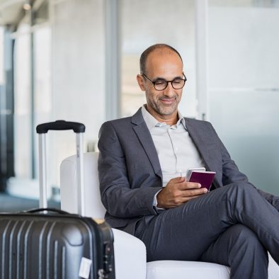 Businessman traveler on phone