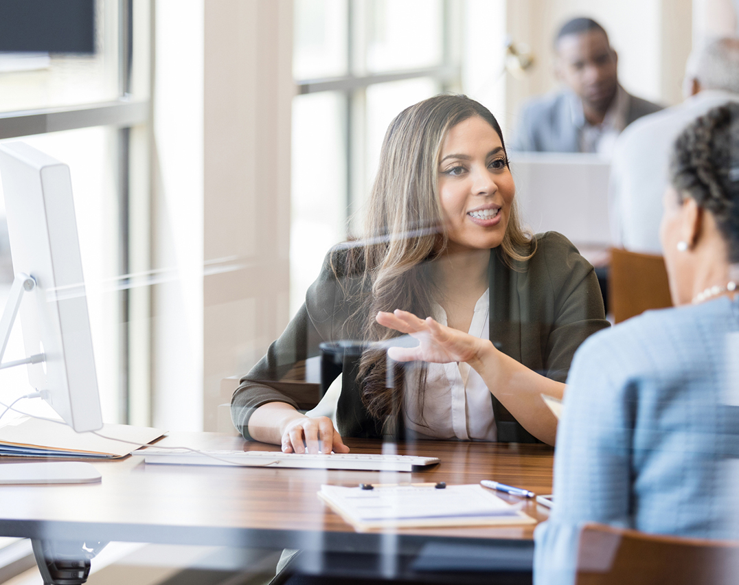 Women talking at bank